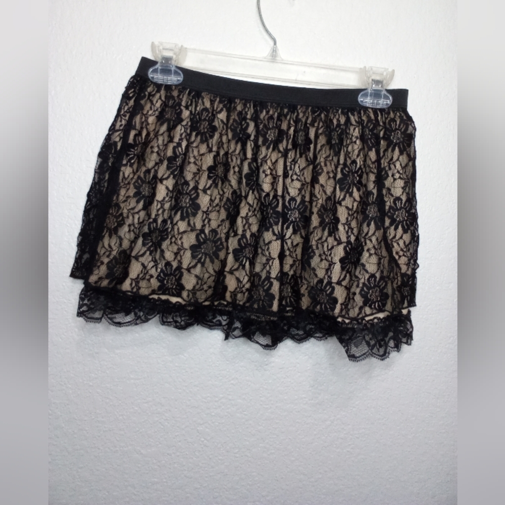Black lace mini skirt with cream lining